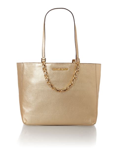 michael kors ladies gold totes.